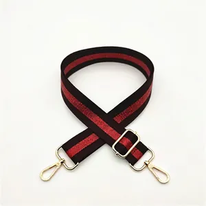 Adjustable red and black striped narrow shoulder strap with gold metal lobster clasps