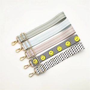 Five assorted wide adjustable woven shoulder straps with gold-tone hardware and patterns