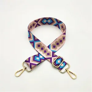 Adjustable geometric patterned shoulder strap with durable gold metal swivel hooks