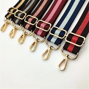 Close-up of adjustable fabric bag straps with metallic gold buckles in various colors