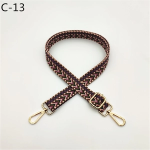 Close-up of durable woven strap with colorful V-shape geometric patterns and gold metal clips