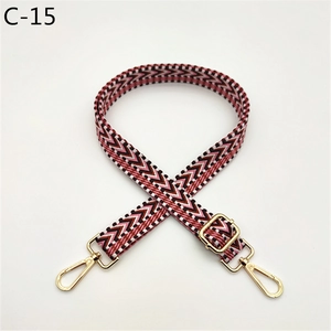 Close-up of a 2.5cm wide adjustable woven bag strap with pink and white wave patterns