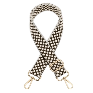 Close-up of the vintage brown geometric pattern cotton strap with gold metal buckles