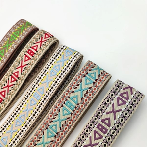 Close-up of five colorful geometric woven shoulder straps with intricate ethnic patterns