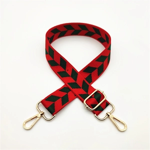 Adjustable woven shoulder strap for bags with red and green chevron pattern and gold clips
