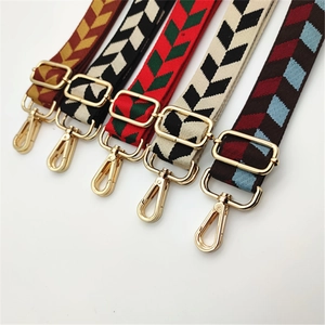 Detail of leaf pattern and geometric woven replacement straps with gold metal hooks