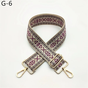 Detail of purple geometric woven strap with gold metal hooks and adjustable buckle