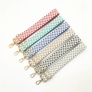 Detail of adjustable thick woven shoulder straps with gold lobster buckles in six colors