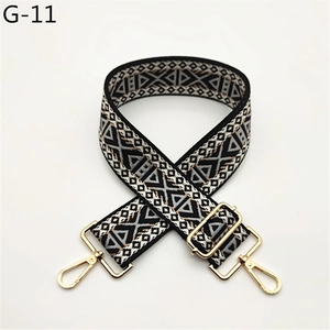 Adjustable wide shoulder strap with geometric triangle pattern and gold lobster clasps