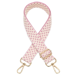 Detail of pink and beige woven adjustable bag strap with golden metal lobster clasps