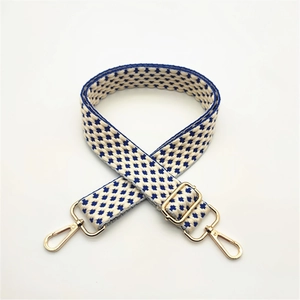 Adjustable woven shoulder strap for bags with blue and white star pattern and gold clips