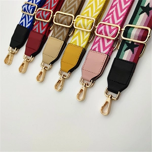 Detailed view of adjustable PU leather bag straps with various patterns and gold metal buckles