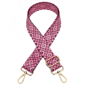 Pink and black geometric woven pattern bag strap with gold metal buckle on white background