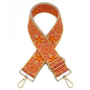 Bohemian style embroidered wide shoulder strap with orange geometric patterns and gold clips