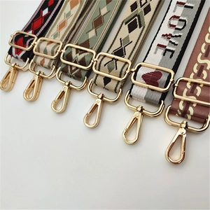 Various patterned nylon bag straps with golden metal hooks in multiple colors