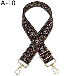Detail of adjustable geometric strap with orange and purple patterns and gold metal hooks