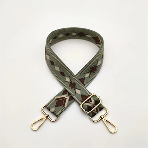 Adjustable geometric knit shoulder strap with gold swivel hooks for crossbody bags