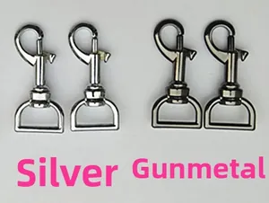 Detail of silver and gunmetal swivel lobster clasps with D-rings for handbag straps