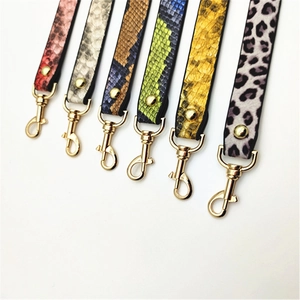 Detailed view of various PU leather straps featuring snake and leopard print patterns