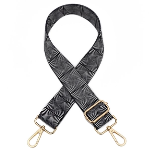 Adjustable black and white geometric woven guitar strap with gold hardware hooks