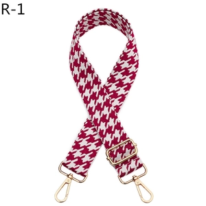 Detail of red houndstooth woven strap with adjustable gold lobster claw clasp