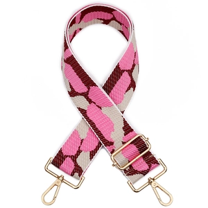 Wide leopard print adjustable bag strap with gold metal hooks on white background