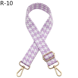 Detail of light purple houndstooth replacement strap with adjustable gold metal buckle