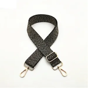 Bandoulière tissée noire et blanche réglable avec crochets en métal doré poli