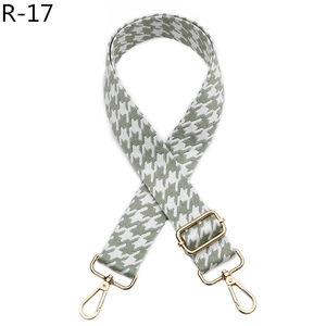 Adjustable houndstooth woven shoulder strap with gold metal swivel hooks in light green