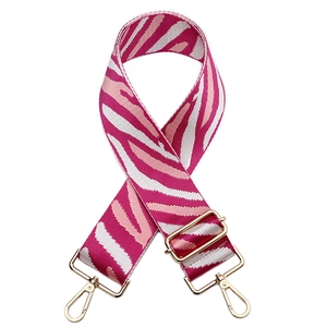 Adjustable zebra pattern fabric bag strap in rose pink and white with gold metal hooks