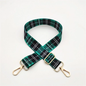 Adjustable green and black plaid fabric bag strap with golden metal lobster clasps