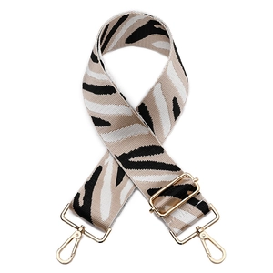 Adjustable wide woven shoulder strap with zebra print and polished gold hardware