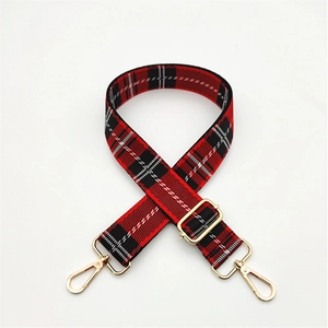 Adjustable red and black plaid replacement shoulder strap with gold metal buckles