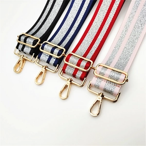 Detail view of four colorful 5cm adjustable woven bag straps with silver glitter thread