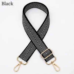 Adjustable black and white herringbone replacement strap with polished gold hardware buckles