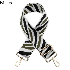 Close-up of zebra stripe strap with gold lobster clasps and adjustable buckle