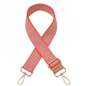 Adjustable coral orange bag strap with silver chevron pattern and gold metal hooks