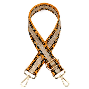 Close-up of leopard print bag strap with golden glitter stripe and metallic gold clasp