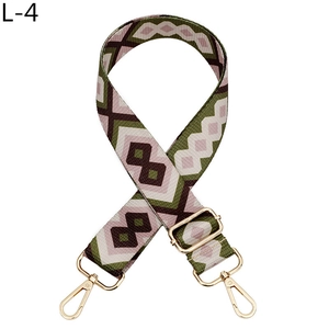 Detail of adjustable polyester canvas bag strap with retro geometric pink and green patterns