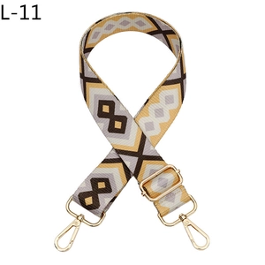 Detail of adjustable geometric diamond pattern strap with gold metal lobster clasps