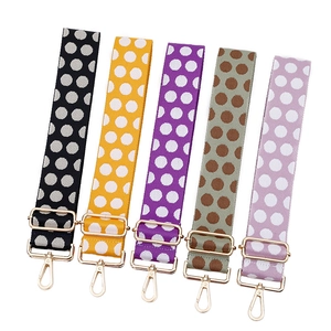 Adjustable wide polka dot patterned shoulder straps with gold metal hooks for handbags