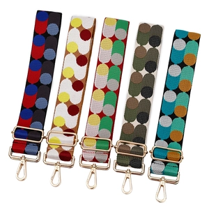 Adjustable woven jacquard bag straps with colorful patterns and gold metal hardware