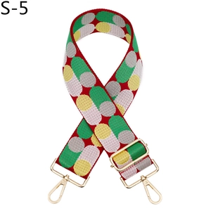 Close-up of colorful traffic light pattern jacquard strap with gold metal lobster clasps