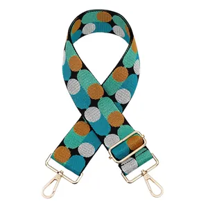 Close-up of adjustable woven strap with vintage dots and pale gold metal lobster clasps