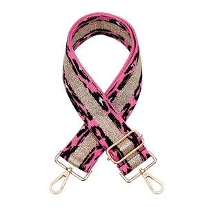 Pink leopard print adjustable bag strap with gold metal buckle on white background