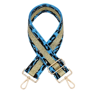 Wide adjustable leopard print bag strap with blue leopard pattern and gold metallic accents