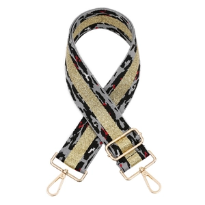 Adjustable leopard pattern bag strap with gold thread and metal hardware on white background