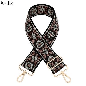 Detail of adjustable folk style jacquard bag strap with vintage floral embroidery