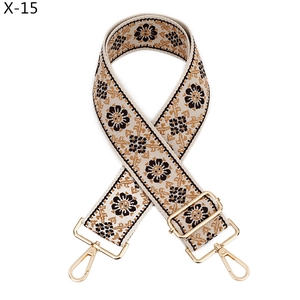 Close-up of adjustable ethnic jacquard strap with sunflower embroidery and gold hooks
