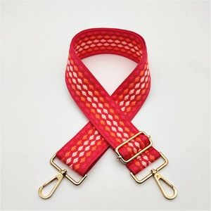 Adjustable wide shoulder strap for bags with red geometric diamond pattern and gold hooks